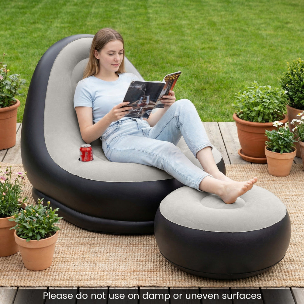 Inflatable lounge sofa with ottoman in grey, featuring a flocked surface, perfect for outdoor relaxation and comfort.