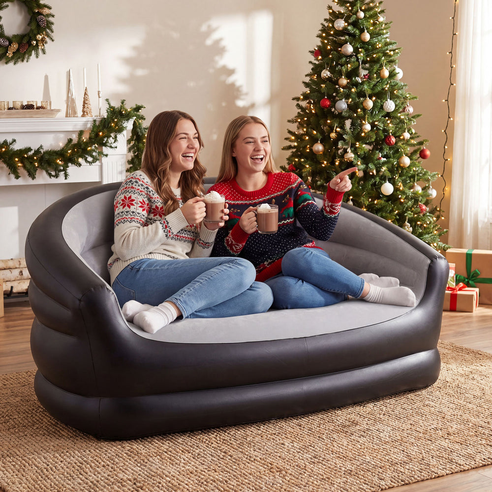 Inflatable loveseat couch in grey with flocked surface, perfect for cozy seating during festive gatherings.