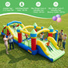 Inflatable obstacle course bounce house with dual slides, rock climbing wall, and tunnels for kids' outdoor fun.