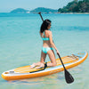 Inflatable stand-up paddle board with adjustable paddle, featuring a vibrant orange design for water sports fun.