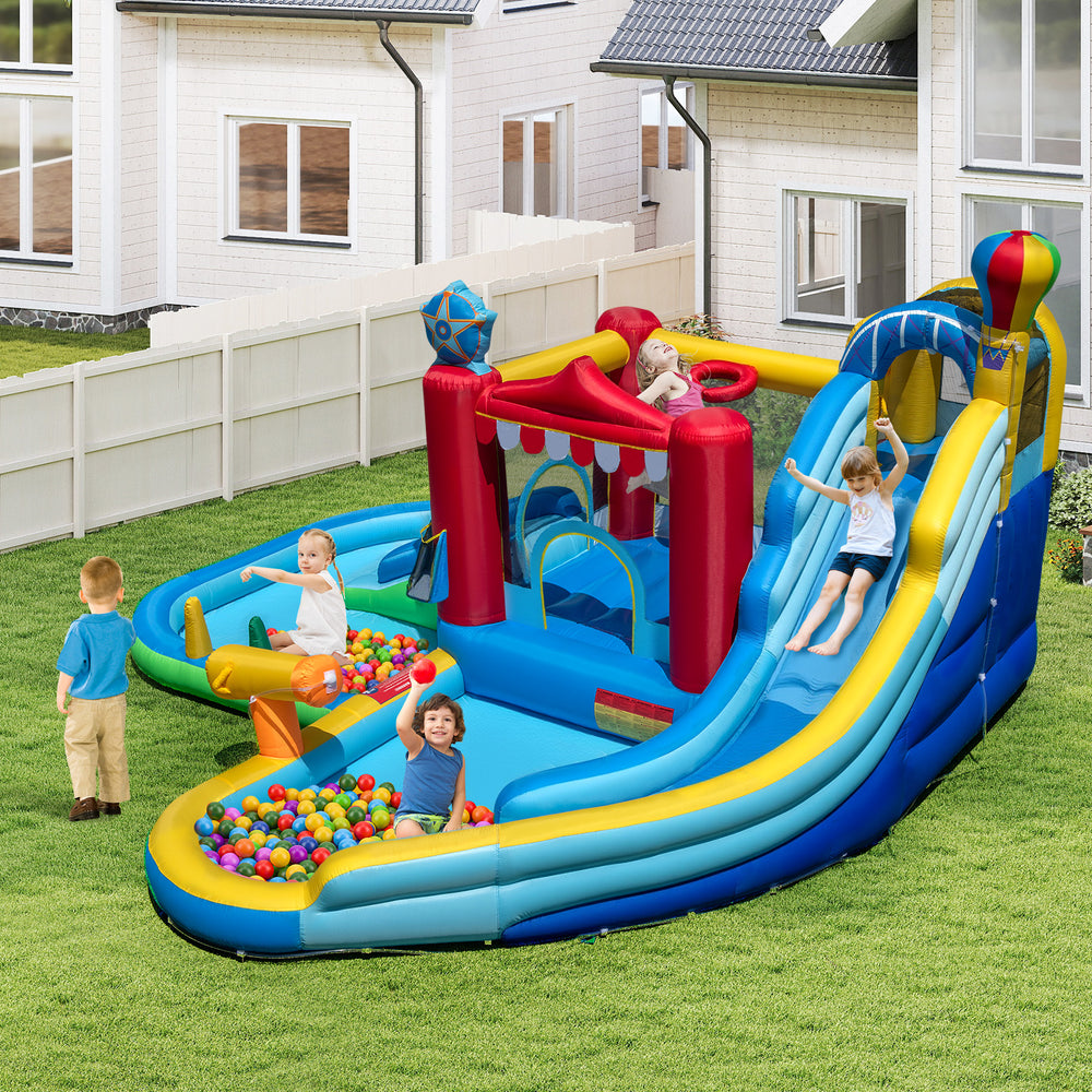Inflatable water park with slide, bounce house, and ball pit for kids' outdoor fun and summer entertainment.