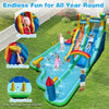 Giant inflatable water slide park with double slides, climbing wall, and splash pool for summer fun in the backyard.