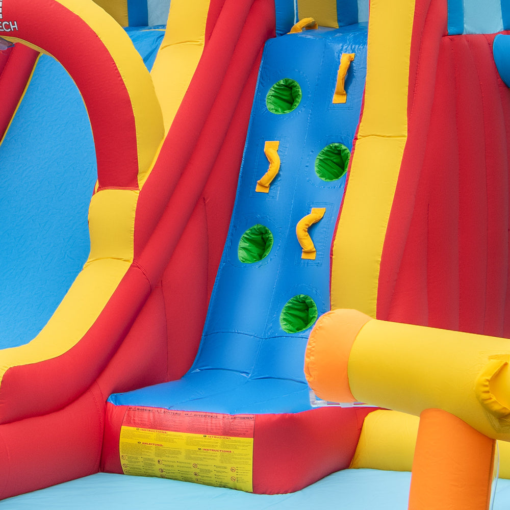 Colorful inflatable water slide with climbing wall and splash area, perfect for summer fun in the backyard.