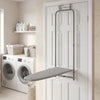 Space-saving gray metal hanging ironing board mounted on a door, ideal for laundry rooms and apartments.
