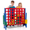 Children playing with the Jumbo 4 in a Row Game Set, featuring red and green chess pieces for indoor and outdoor fun.