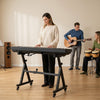Adjustable keyboard stand in black, suitable for 49 to 88 keys electric pianos, ideal for home and live performances.
