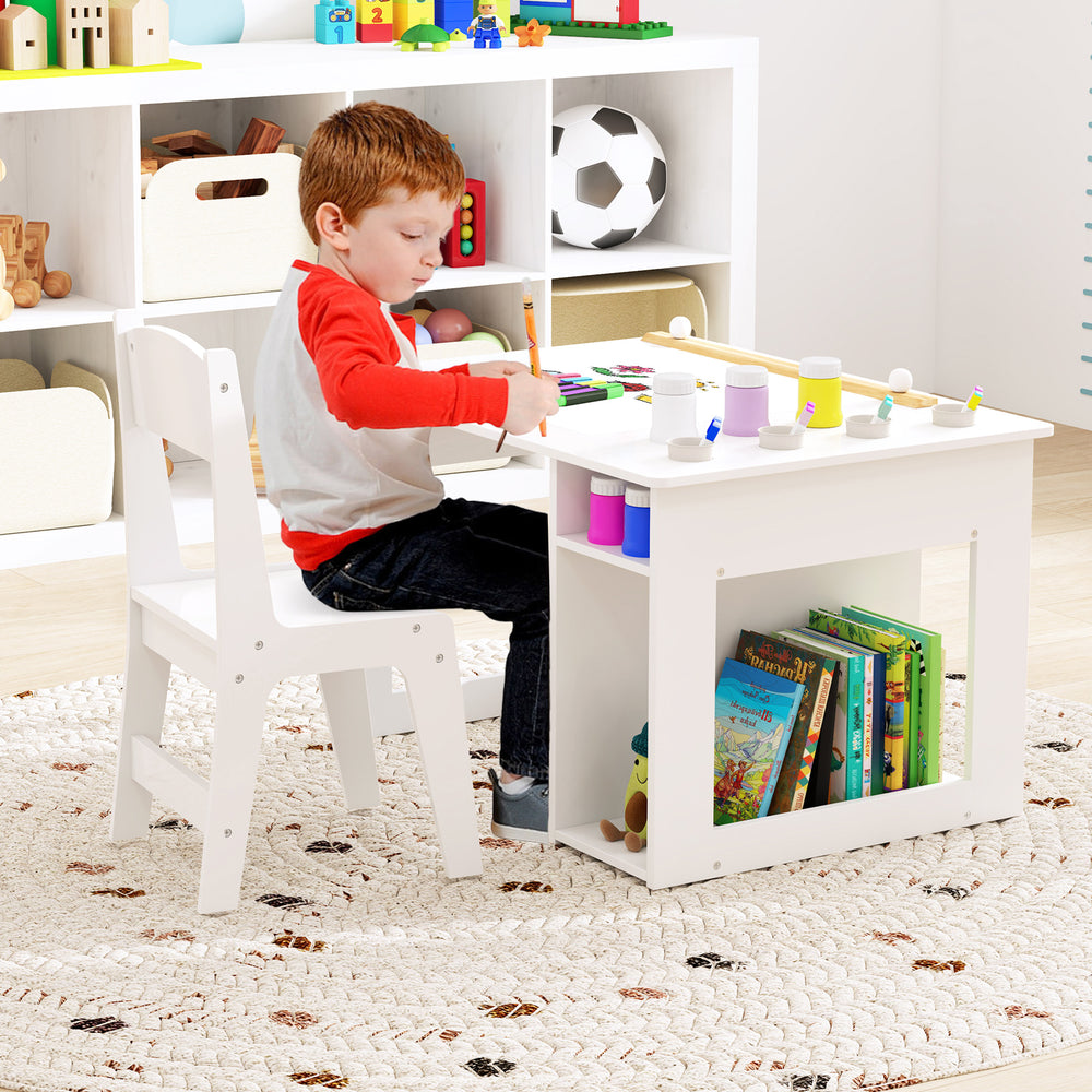Kids art table and chair set in white with removable paint cups and storage for crafts, ideal for creative play.