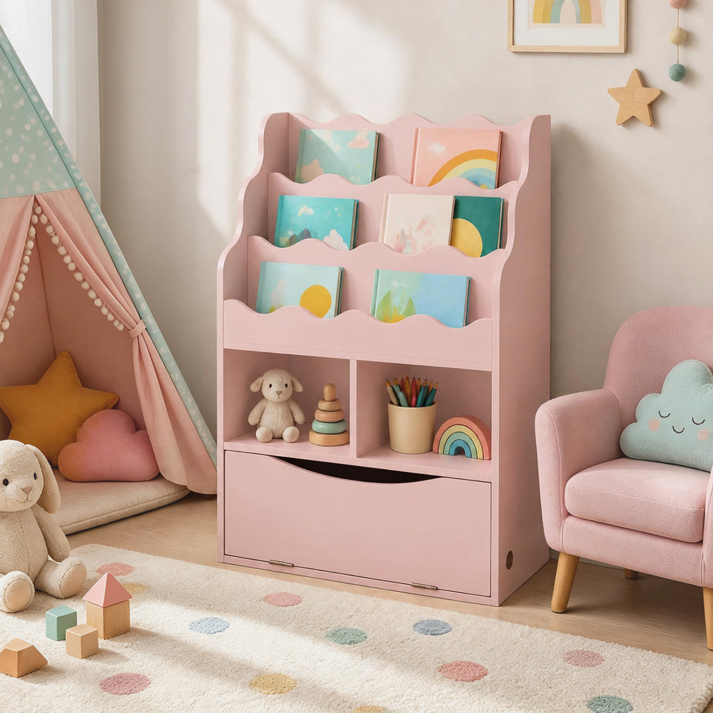 Pink kids bookcase with generous storage, including two open cubes and a flip-down cabinet, encourages tidy organization.