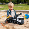 Scania construction truck set with sounds and lights features a tilting flatbed and adjustable digging arm for kids' play.