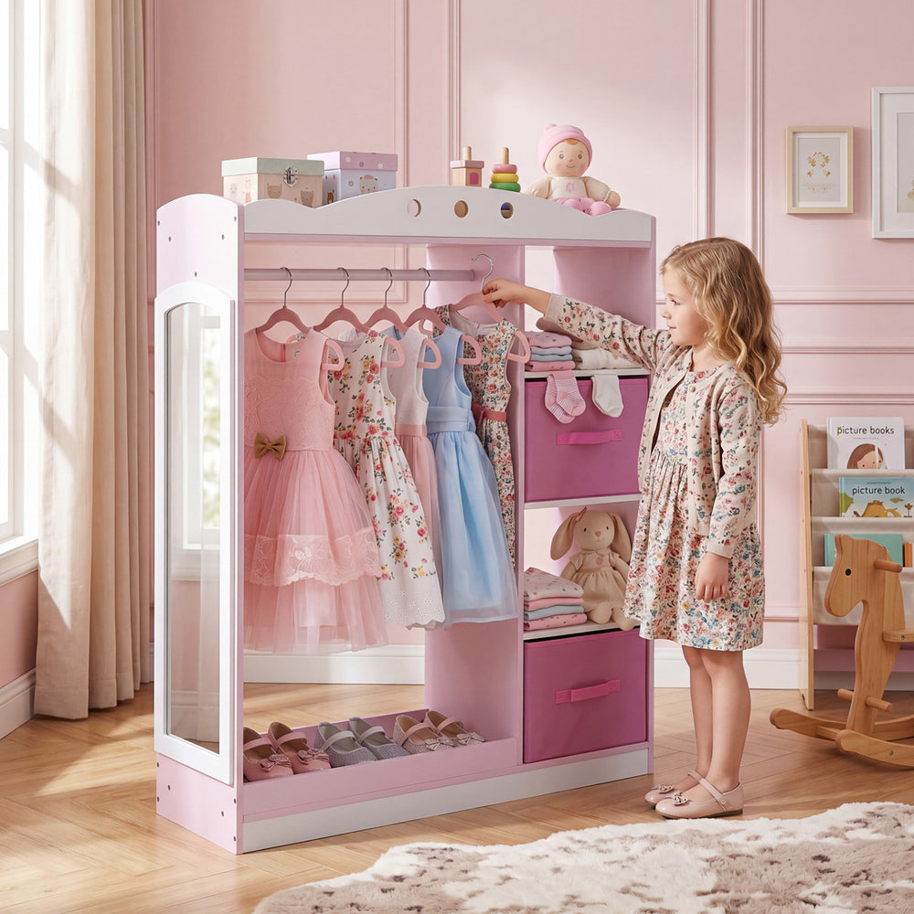 Kids dress-up storage in pink with full-length mirror, hanging rod, and open shelves for easy access and organization.