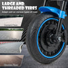 Close-up of the large, threaded tire of the blue kids electric motorcycle, suitable for various road types.
