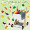 Large wooden shopping cart with colorful vegetable accessories for kids' imaginative grocery store play.