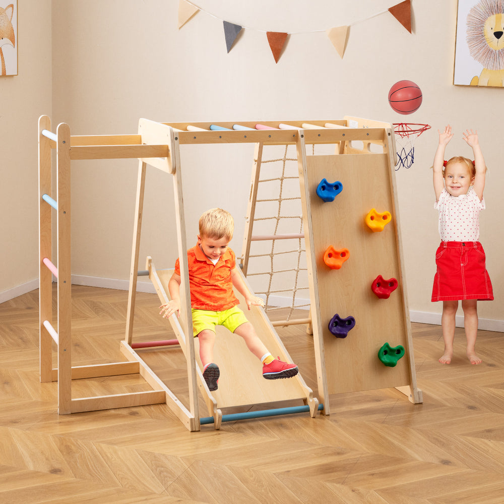 Kids Indoor Playground 6-in-1 Jungle Gym with slide, climbing wall, and ball toss for ages 3-14, promoting active play.