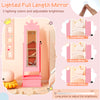 Kids jewelry armoire in pink featuring a lighted full-length mirror with adjustable brightness and crown design for.