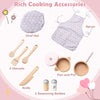 Kids kitchen playset with pink apron, chef hat, utensils, knife, pot, and seasoning bottles for imaginative cooking fun.