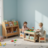 Kids 4-in-1 activity table set with reversible tabletop, natural wood bookshelf, and sensory swivel chair for playtime.