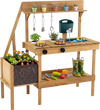 Wooden play kitchen with planter box, stoves, sink, and accessories for outdoor pretend play and sensory exploration.