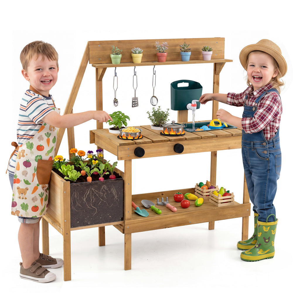 Wooden play kitchen with planter box, stoves, sink, and accessories, designed for outdoor pretend play for toddlers.
