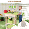 Kids mud kitchen featuring removable pots, a watering can, and smooth wheels for easy mobility in a mini garden setup.