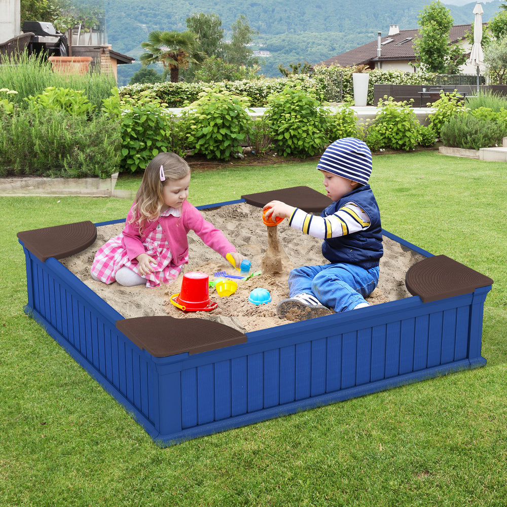 Kids playing in a large navy outdoor sandbox with corner seats, covered with an oxford cover for protection.