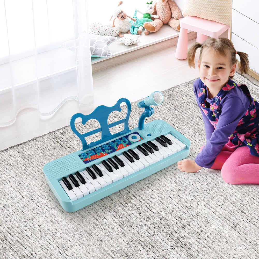 Kids piano keyboard in blue with 37 keys, microphone, and detachable legs, designed for fun and learning for ages 3+.