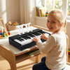 Kids piano keyboard with 30 keys, music stand, and rounded corners, designed for safe, portable play for beginners.