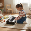 Kids piano keyboard with 30 keys, designed for beginners, promoting musical skills in a cozy playroom setting.