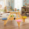Kids picnic table with stools, made of durable wood, featuring a foldable adjustable umbrella for outdoor fun.