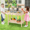 Kids play kitchen set featuring wooden stoves, vegetables, and pots, perfect for imaginative play in natural wood.