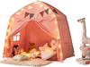 Interior view of the pink kids play tent showcasing cozy plush toys and soft cushions, perfect for imaginative playtime.