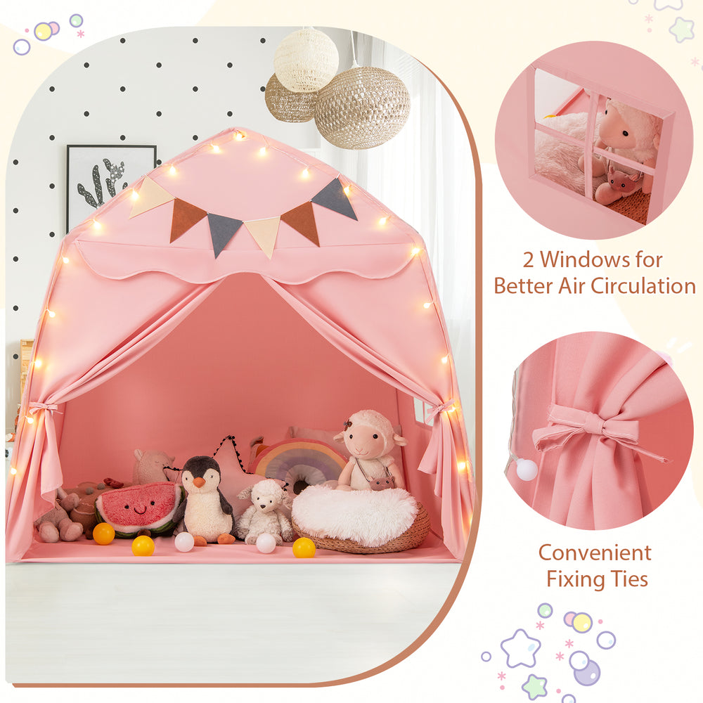 Extra large pink kids play tent with string lights, featuring two windows for air circulation and a charming boho.