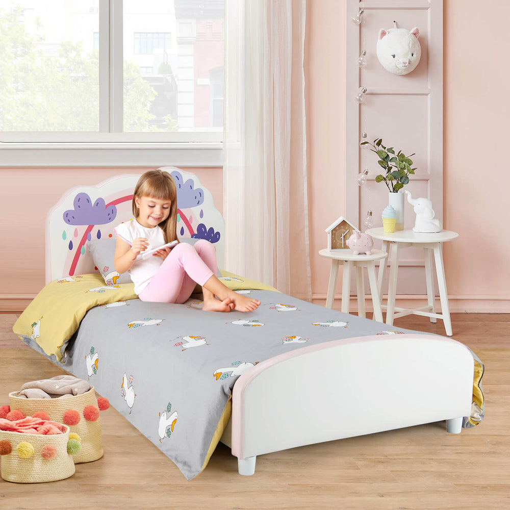 Kids twin size upholstered bed with rainbow-patterned headboard and soft padding, perfect for transitioning from crib.