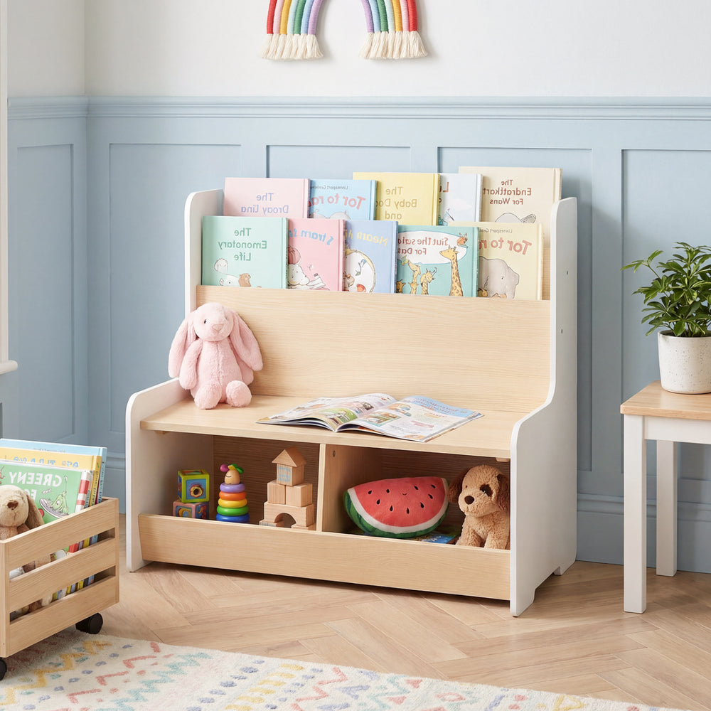 Kids reading nook featuring a white bookshelf with a bench, two cubbies, and a detachable cushion for comfort.