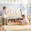 Kids Reading Nook featuring a white bookshelf, bench, and toy storage with a comfy detachable seat cushion for playtime.