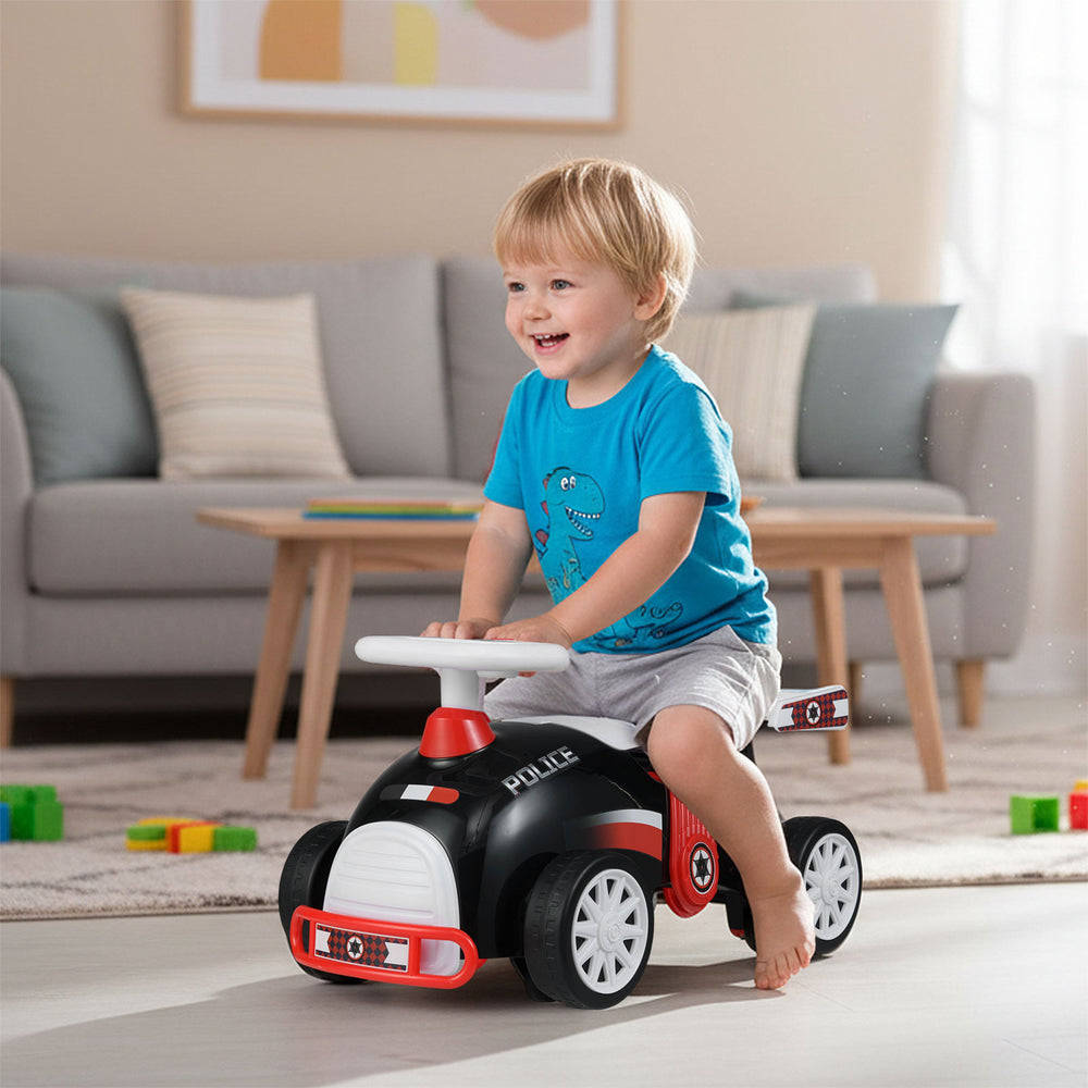 Kids ride-on car sliding toy in black and red with music, under-seat storage, and smooth universal wheels for fun play.