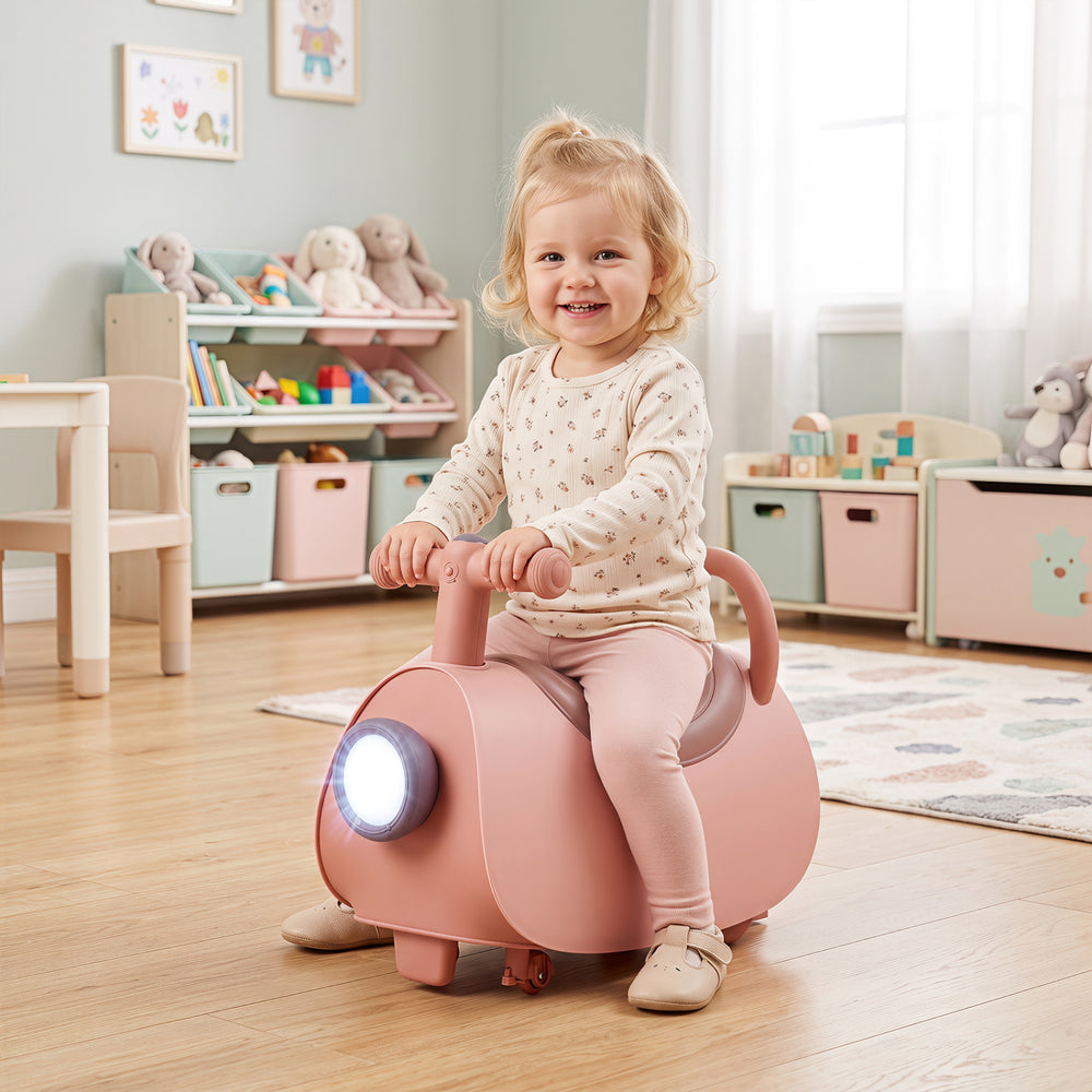 Kids ride-on push car in pink with a fun design, featuring a backrest and bright headlight for engaging playtime.