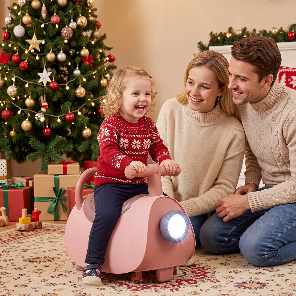 Kids ride-on push car in pink with a fun design, featuring a backrest and hidden storage for toys and accessories.