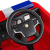 Steering wheel of the red Kids Ride on Fire Truck with remote control, featuring buttons for sirens and lights.