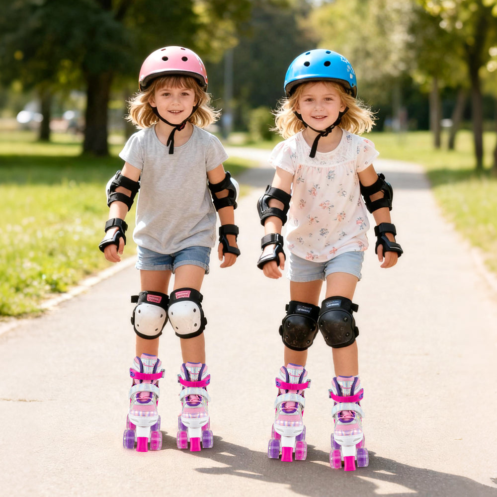 Two girls wearing adjustable kids roller skates with light-up wheels, enjoying a sunny day in the park.