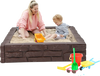 Kids playing in a brown HDPE sandbox with cover, designed for 1-4 children, ideal for outdoor fun and creativity.