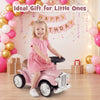 Kids sit-to-stand vehicle in pink with working steering wheel and under-seat storage, perfect for little ones' fun.