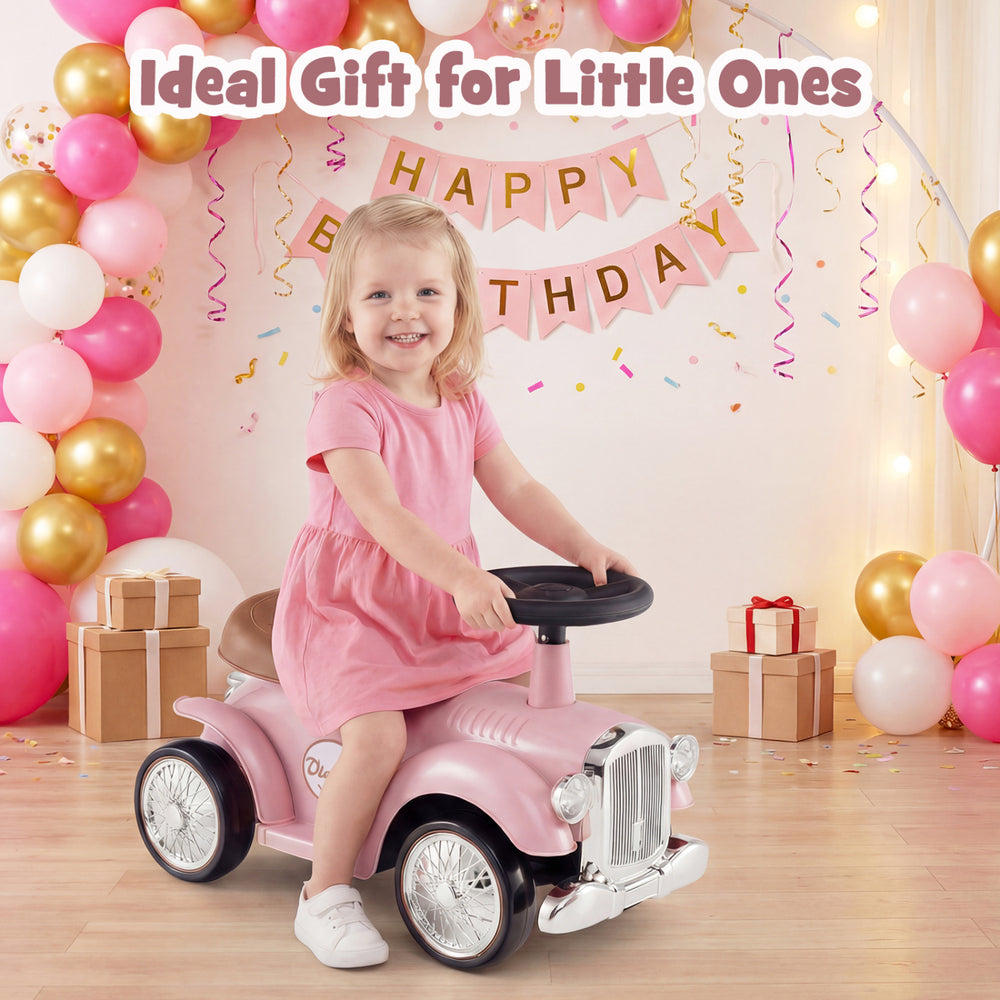 Kids sit-to-stand vehicle in pink with working steering wheel and under-seat storage, perfect for little ones' fun.
