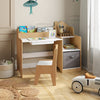 Kids study desk and chair set in natural wood with open shelves, drawer, and fabric storage bin for organized play.