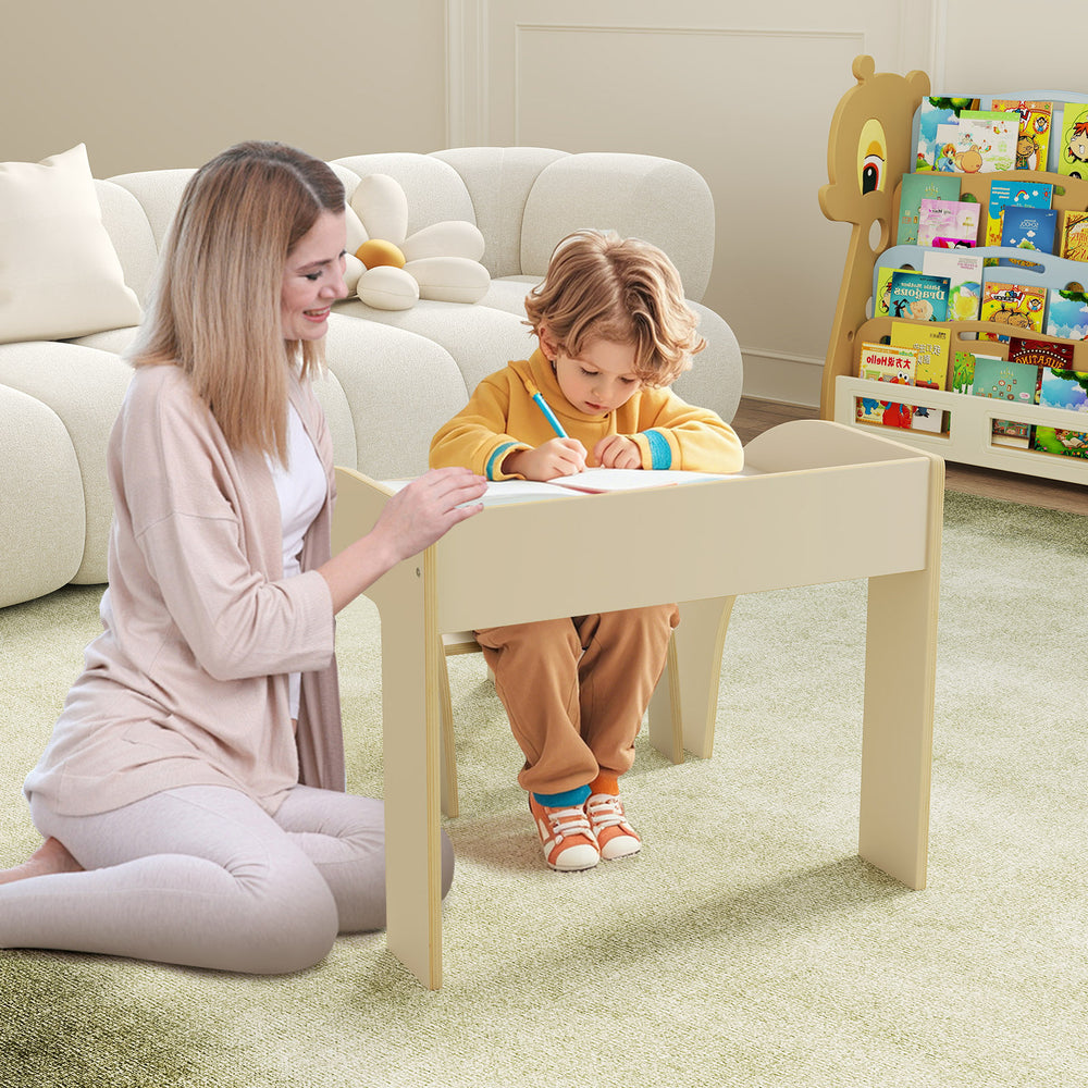 Kids table and chair set in white with wide tabletop and curved edges, perfect for playtime and learning in a child's.