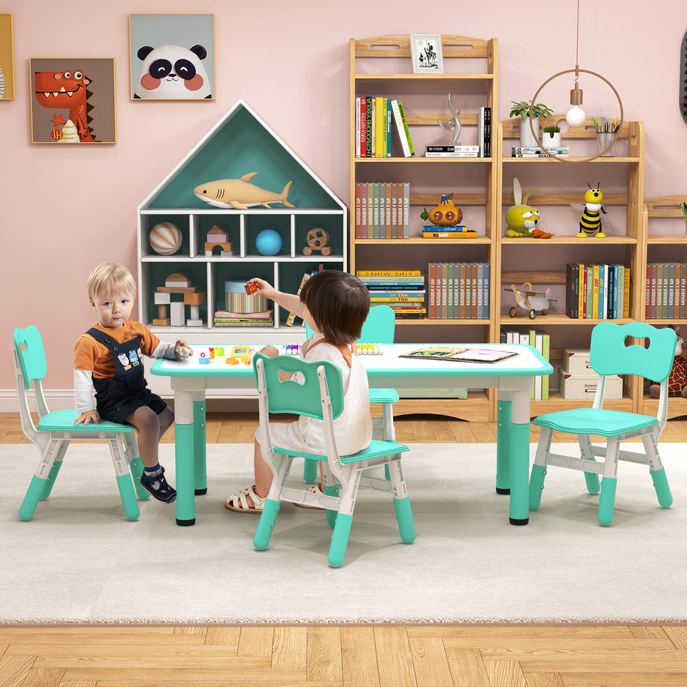 Kids table and chairs set in green with adjustable features, perfect for painting and play in a children's room.