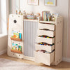 Kids toy storage organizer in beige with 5 removable bins and enclosed cabinet, perfect for a tidy playroom.