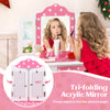 Tri-folding acrylic mirror on a pink polka dot dressing table, adjustable for kids' pretend play and makeup application.