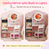 Kids vanity desk with lighted mirror, storage shelves, and chair set in white for pretend play and dressing up.