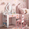 Kids vanity set in white and pink featuring a crown mirror, heart-shaped cutout, and convenient storage for girls.