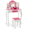Kids vanity table and stool set in pink with polka dots, featuring a tri-fold mirror and ample storage for accessories.